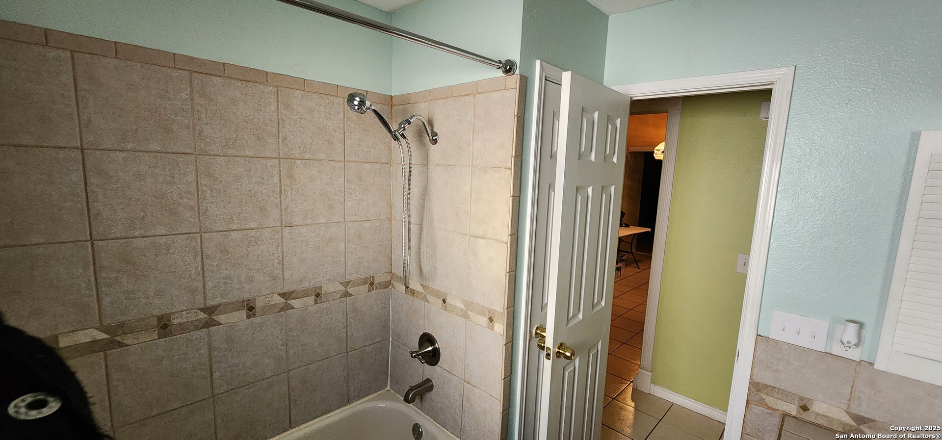 6907 Raintree Path San Antonio, TX 78233 - Photo 14 of 24 a bathroom with a shower