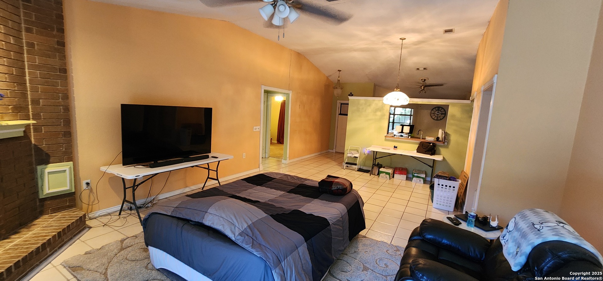 6907 Raintree Path San Antonio, TX 78233 - Photo 8 of 24 a bedroom with a bed and a flat screen tv