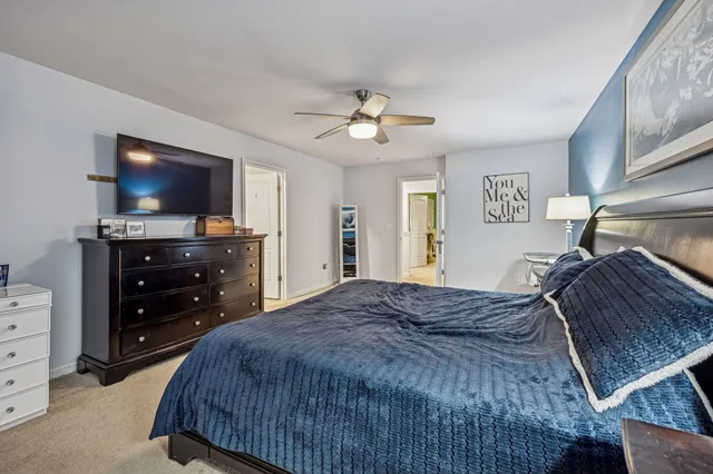 a bedroom with a bed and a television