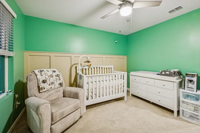a bedroom with furniture and window