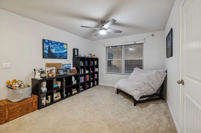 a living room with lots of furniture and a window