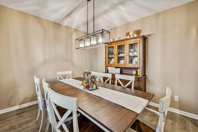 a view of a dining room that has a table and chairs