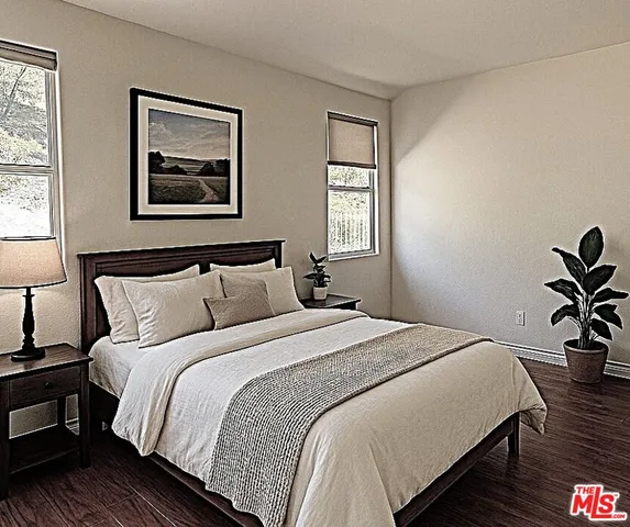 a bedroom with bed and window