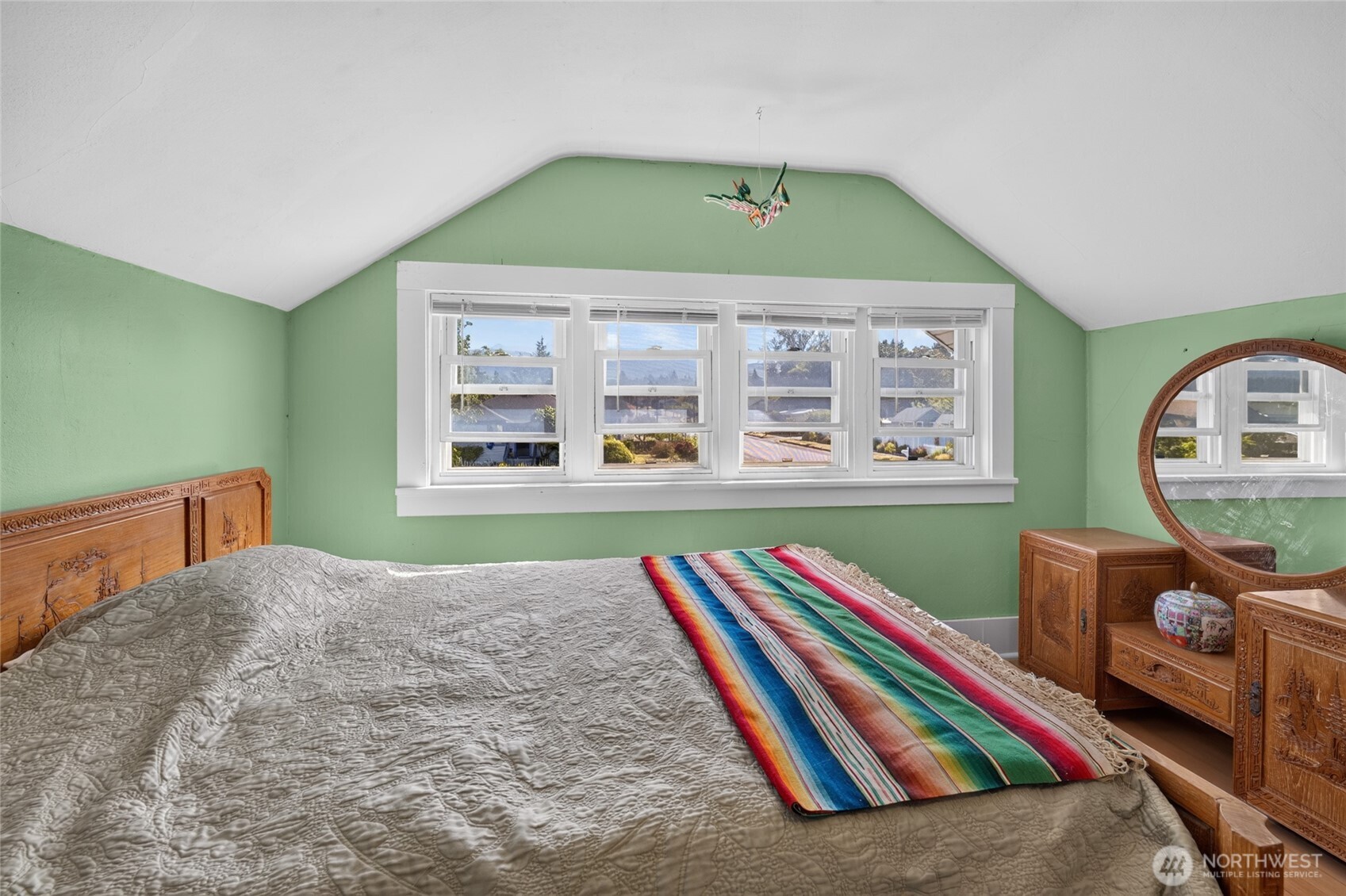 237 West 3rd Street Port Angeles, WA 98362 - Photo 29 of 40 a bedroom with a bed and a large window