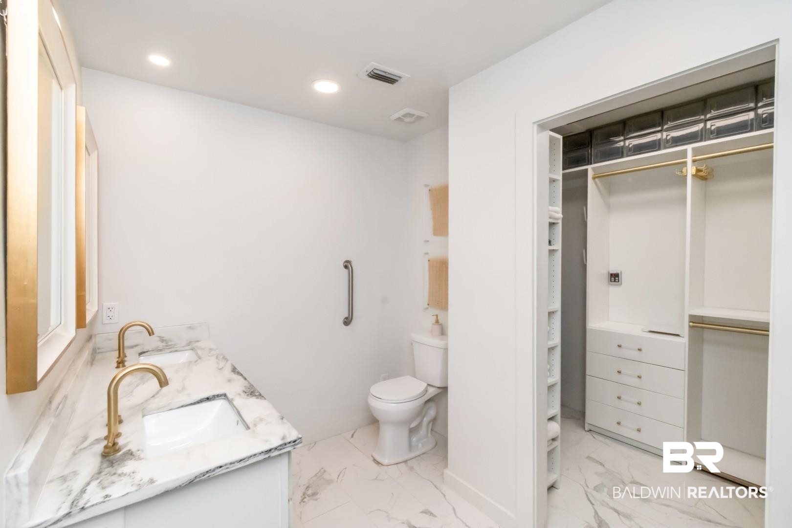 18 Princess Anne Road Mobile, AL 36608 - Photo 24 of 41 Bathroom with a walk in closet, double vanity, recessed lighting, and light marble finish floors