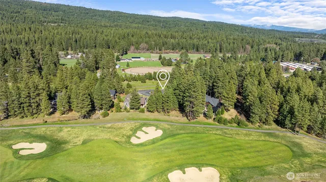 a view of a golf course with an outdoor space