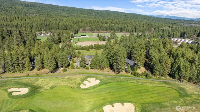 a view of a golf course with an outdoor space