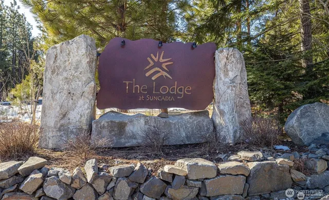 a view of a swimming pool with outdoor seating