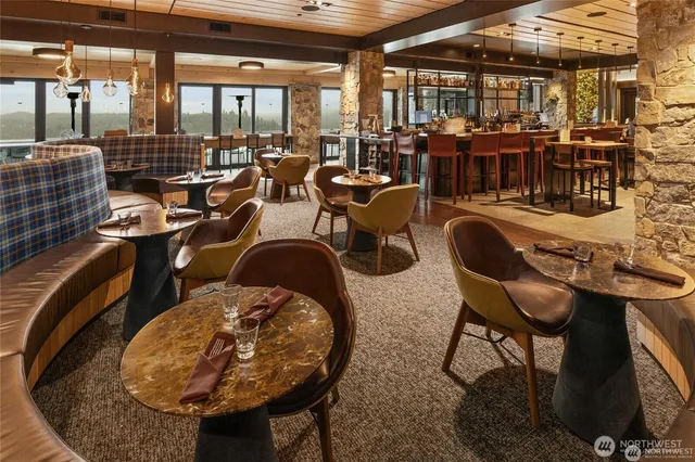 a group of people sitting at tables in a room