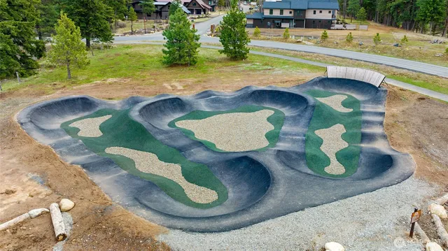 a wooden bench sitting in front of a building