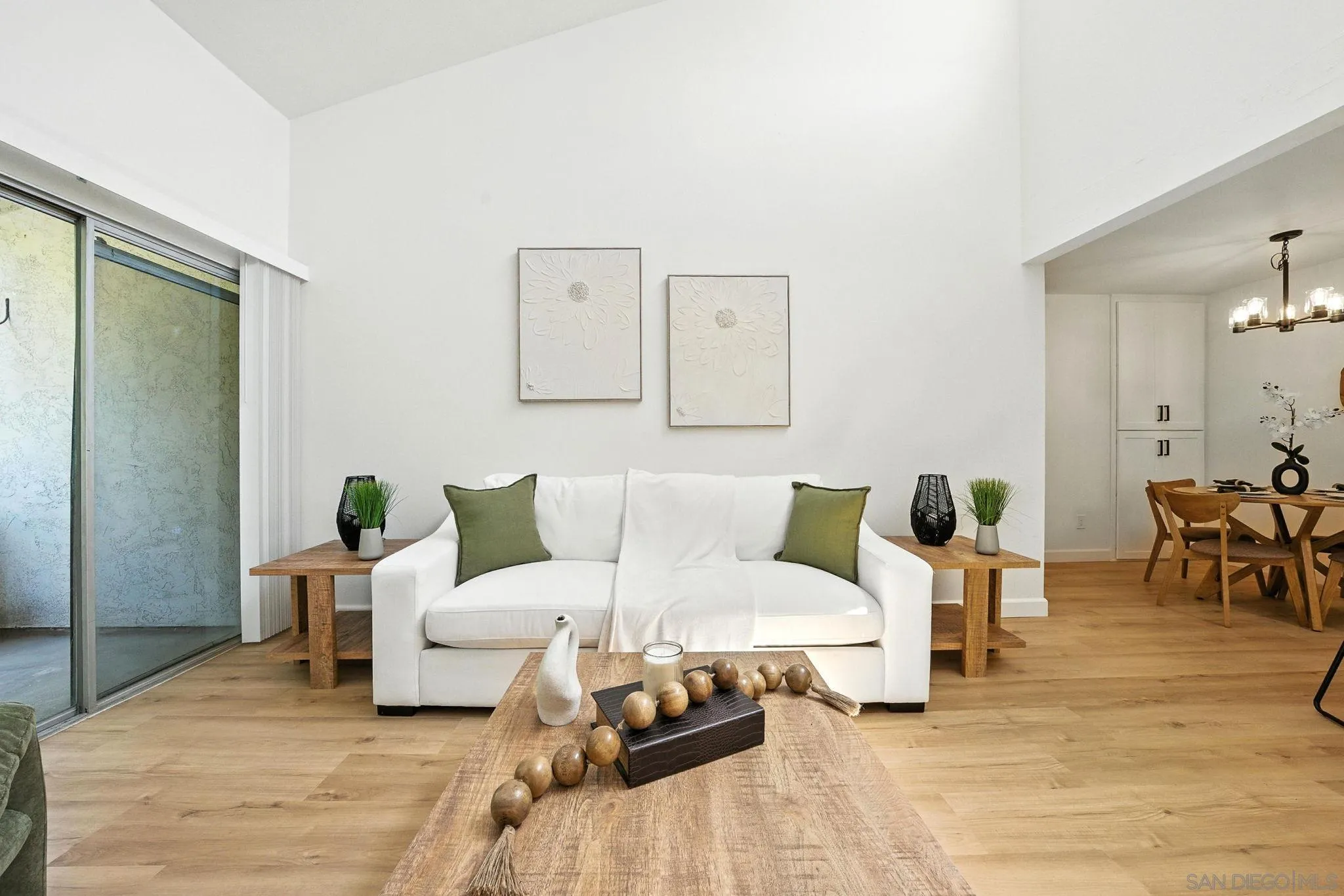 3575 Ruffin Road, Unit 204 San Diego, CA 92123 - Photo 8 of 29 a living room with furniture and wooden floor