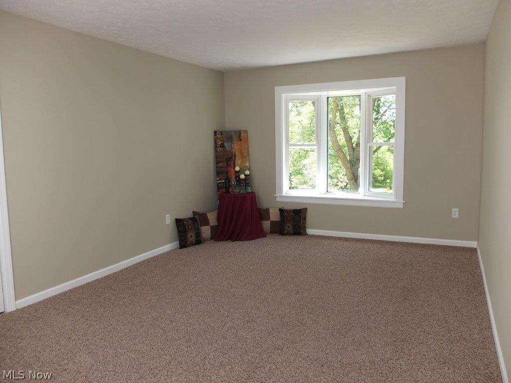 2555 Ranfield Road Mogadore, OH 44260 - Photo 7 of 25 Master suite with bay window, walk in closet and skylight.