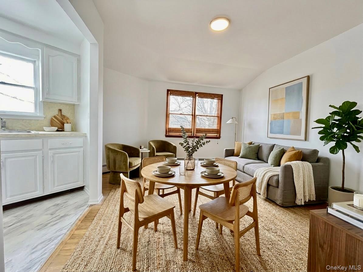 a view of a dining room with furniture and window