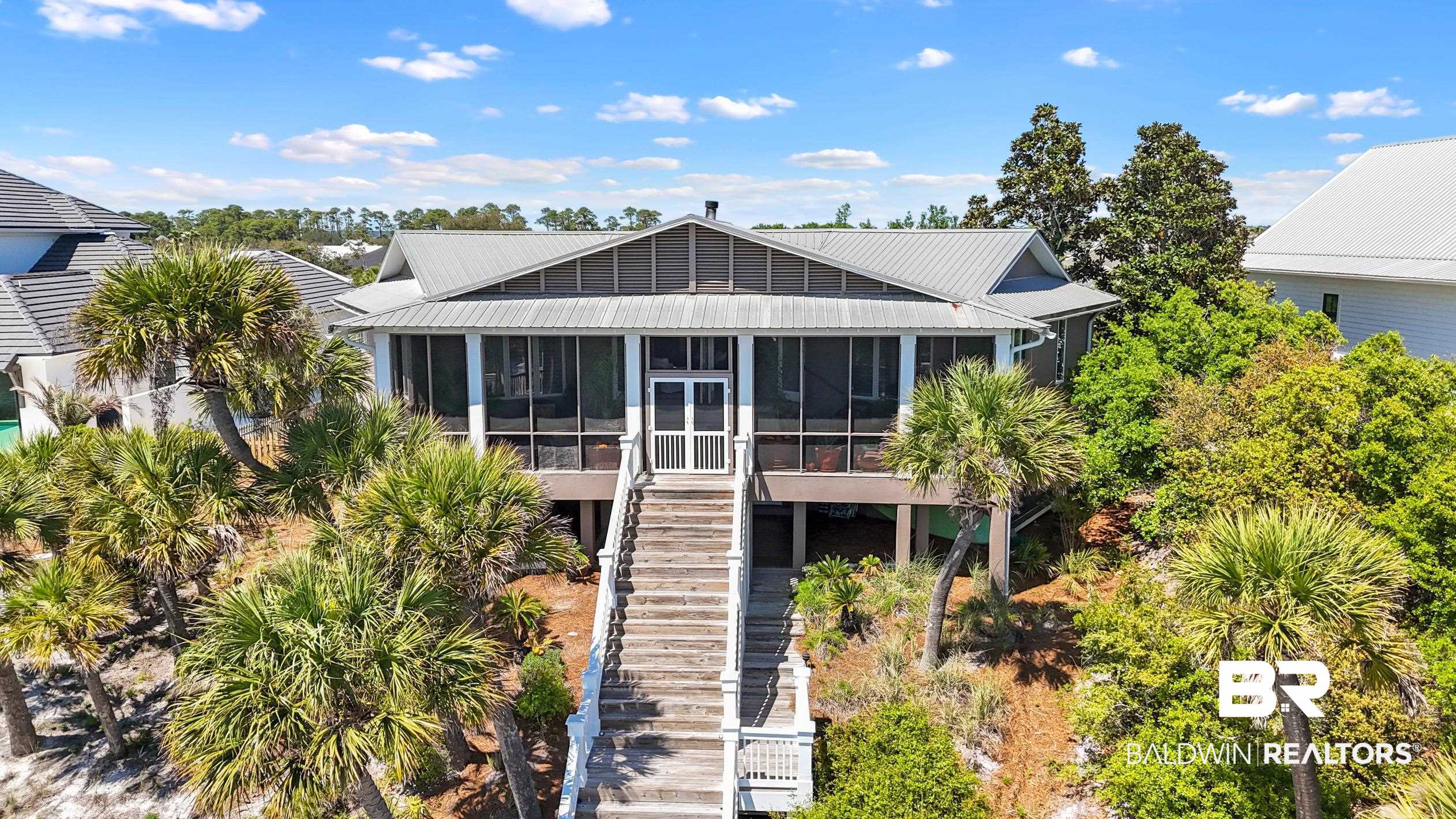 31304 River Road Orange Beach, AL 36561 - Photo 68 of 78 View of front of house featuring metal roof, stairway, and a sunroom