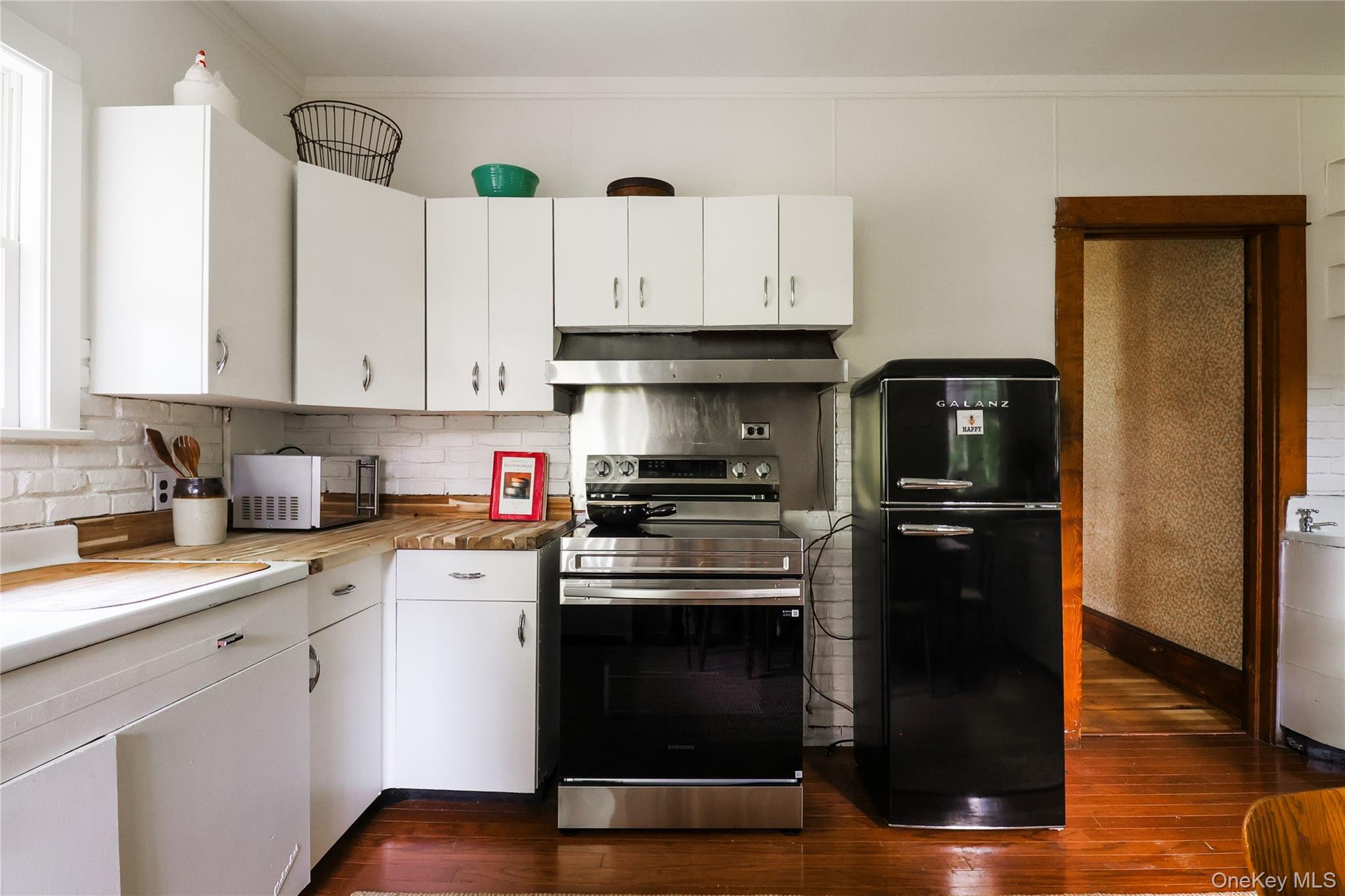 12 Highview Avenue Callicoon, NY 12723 - Photo 19 of 39 a kitchen with a stove and a refrigerator