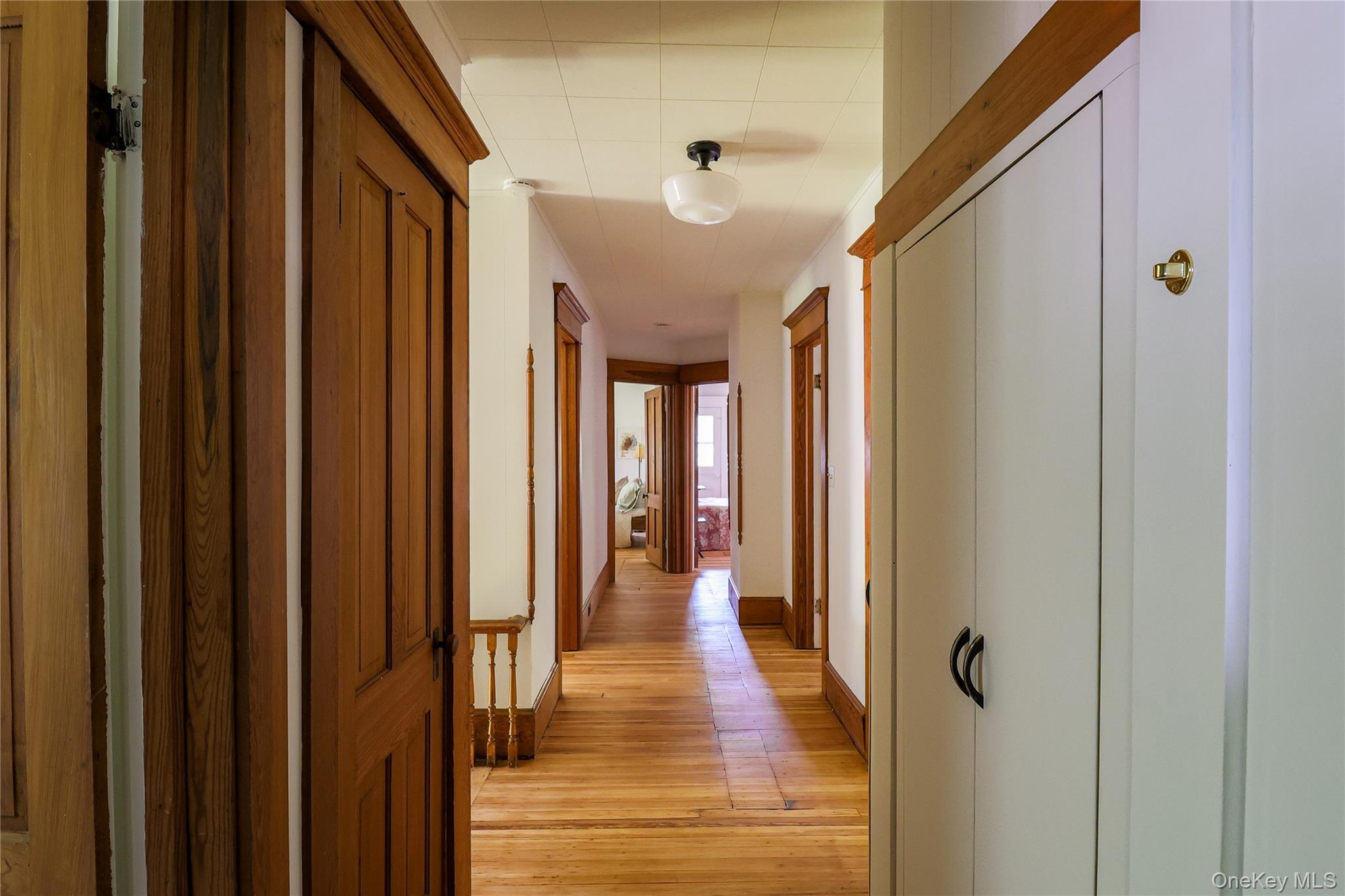 12 Highview Avenue Callicoon, NY 12723 - Photo 20 of 39 a view of a hallway with wooden floor and staircase