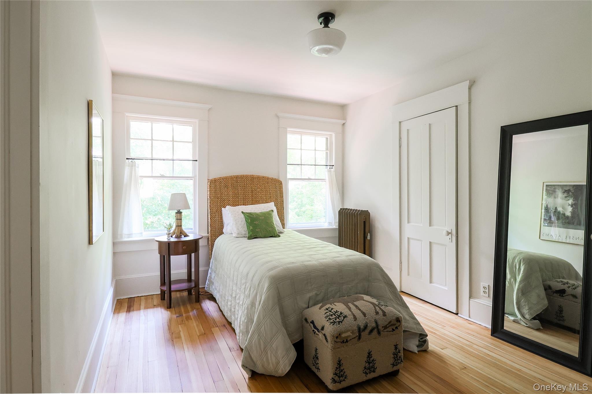 12 Highview Avenue Callicoon, NY 12723 - Photo 21 of 39 a bedroom with a bed and wooden floor