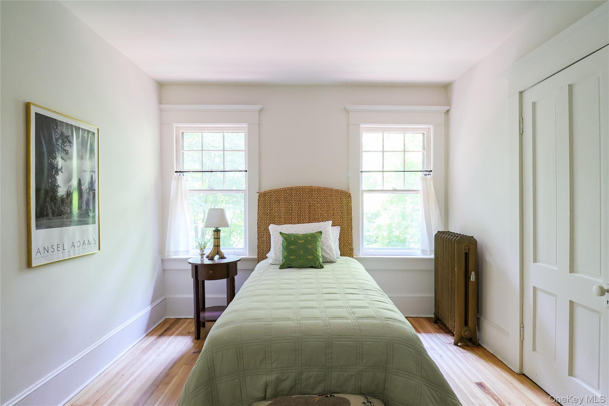 12 Highview Avenue Callicoon, NY 12723 - Photo 22 of 39 a bedroom with a bed and wooden floor
