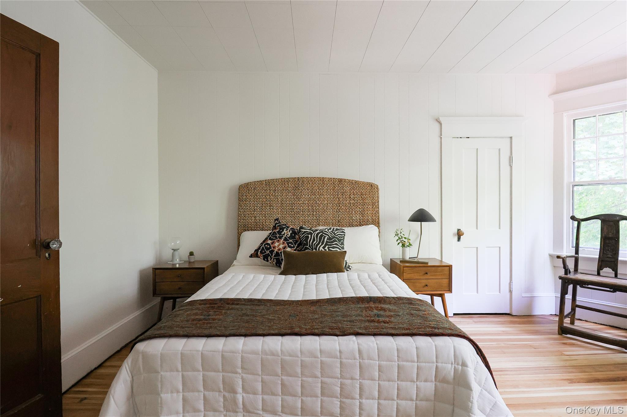 12 Highview Avenue Callicoon, NY 12723 - Photo 24 of 39 a bedroom with a bed and a potted plant on the dresser