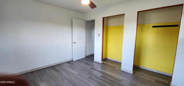 a backyard of a house with lots of green space and outdoor seating