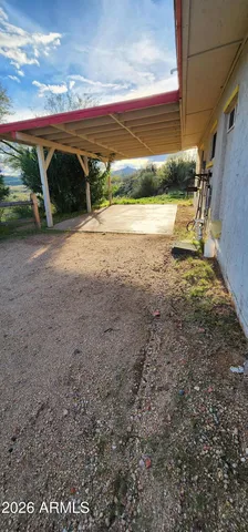 a view of a street with a building in the background