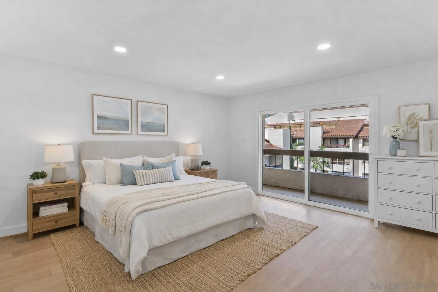 6747 Friars Road, Unit 130 San Diego, CA 92108 - Photo 11 of 32 a spacious bedroom with a bed and a cabinets