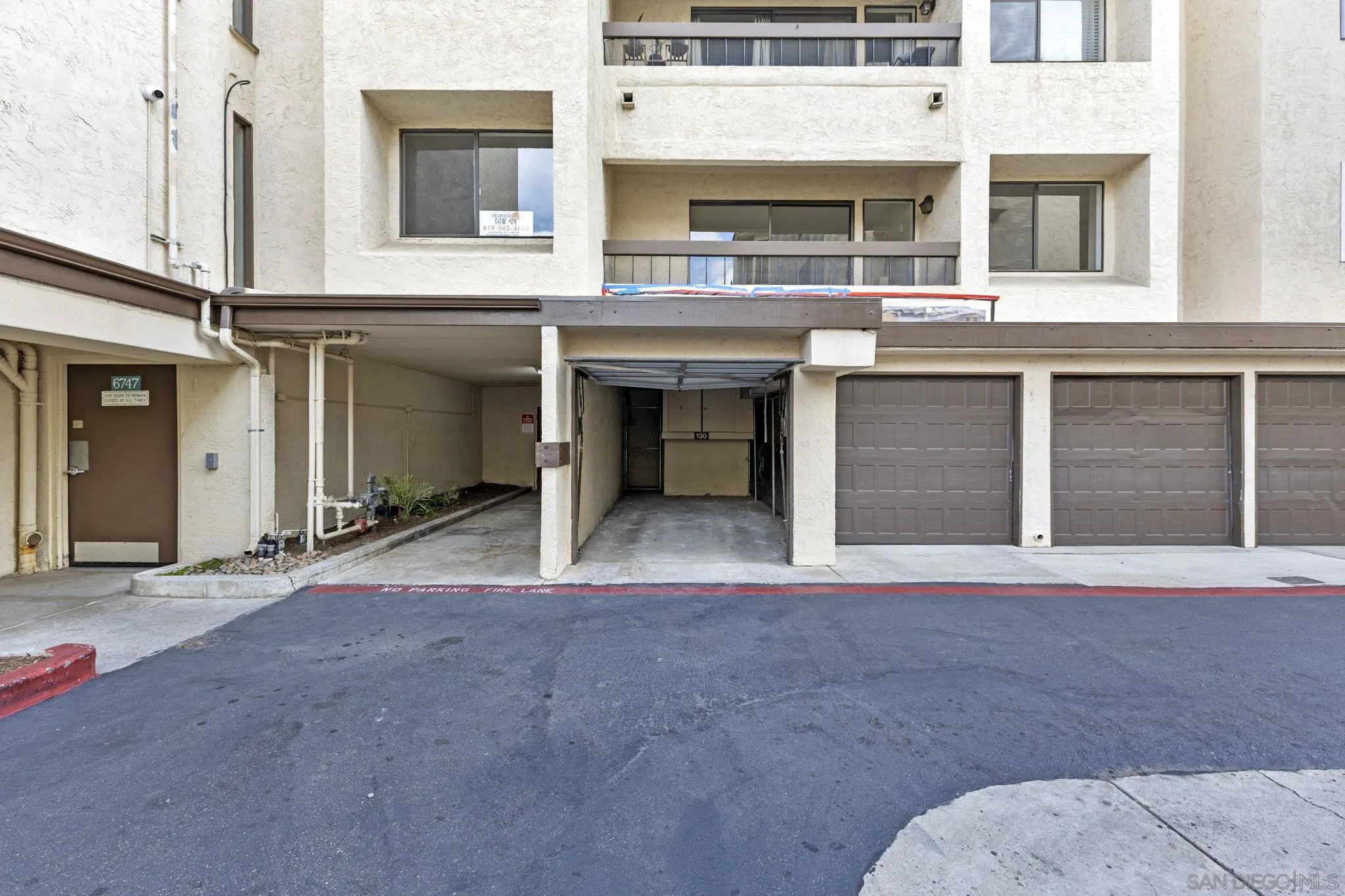 6747 Friars Road, Unit 130 San Diego, CA 92108 - Photo 28 of 32 a view of a building with a garage