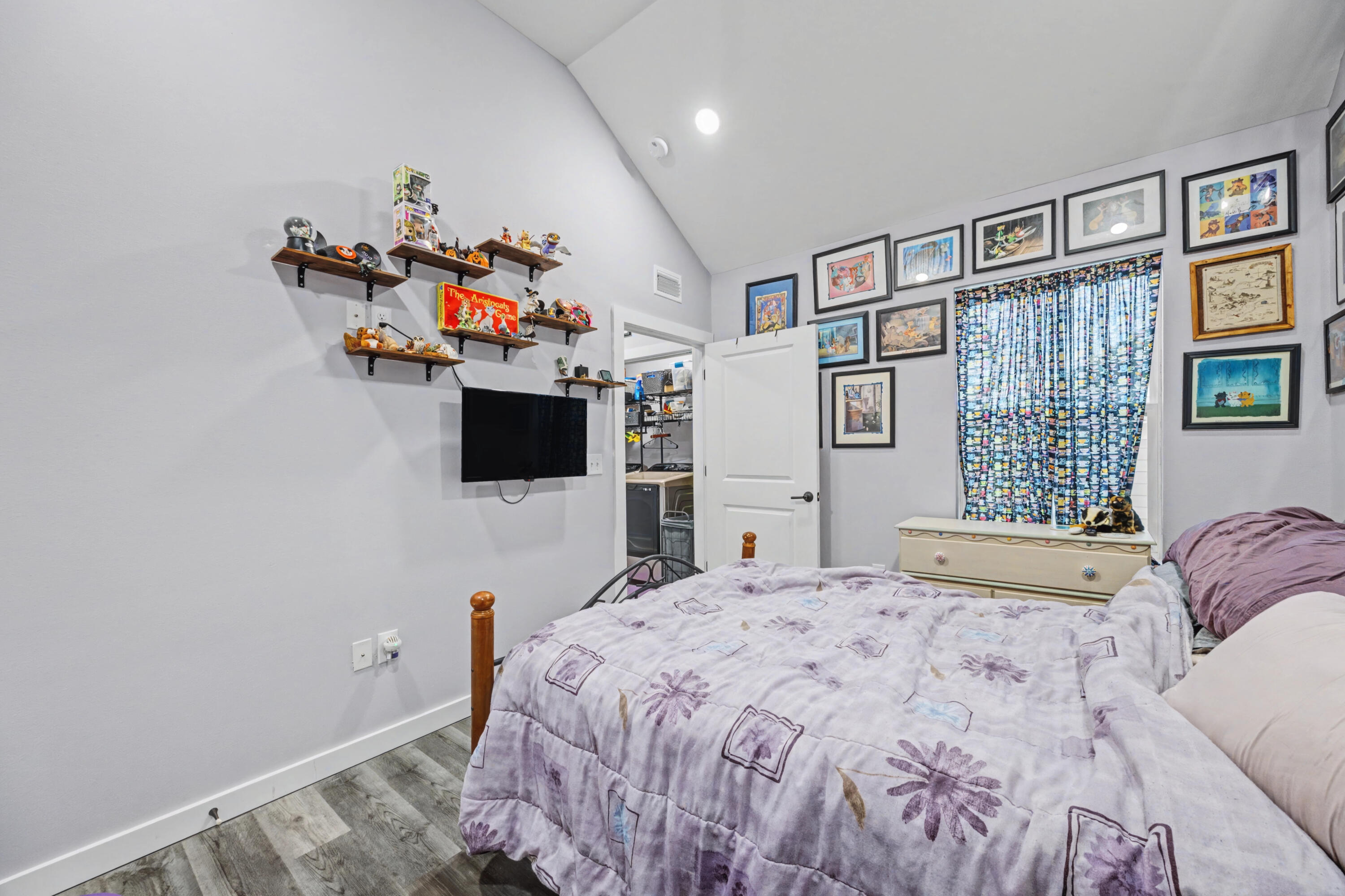 255 West Renoir Road DeFuniak Springs, FL 32433 - Photo 16 of 30 a bedroom with a bed and a flat screen tv
