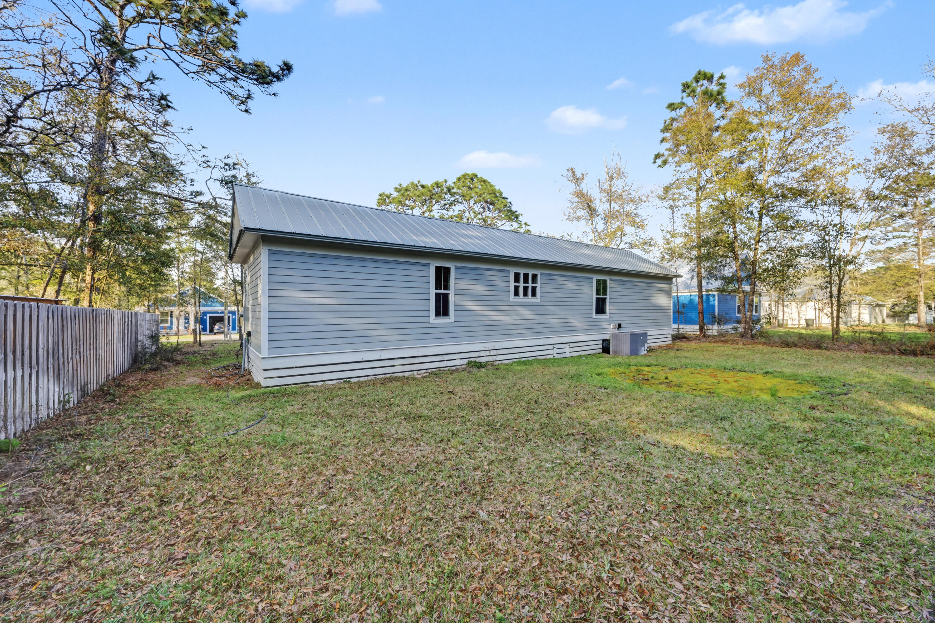 255 West Renoir Road DeFuniak Springs, FL 32433 - Photo 21 of 30 a front view of a house with garden