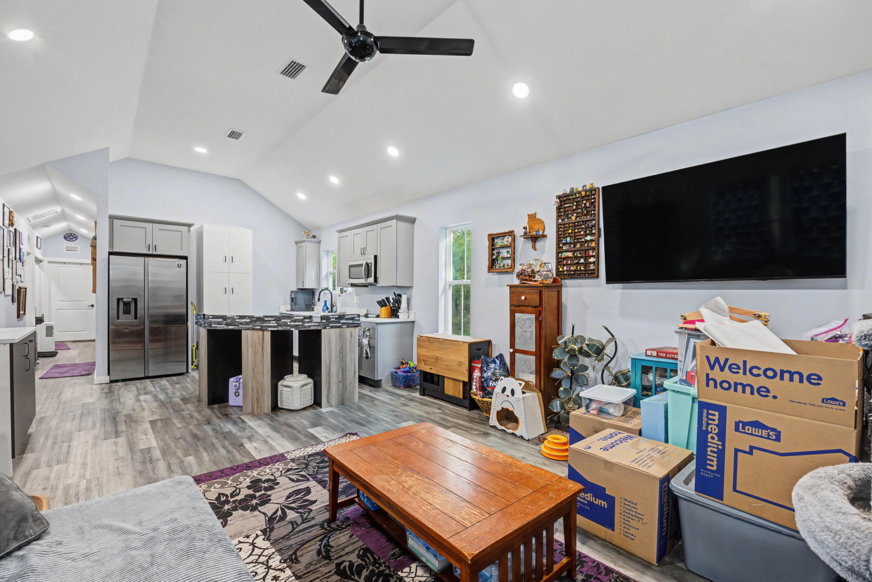 255 West Renoir Road DeFuniak Springs, FL 32433 - Photo 5 of 30 a living room with furniture and a flat screen tv