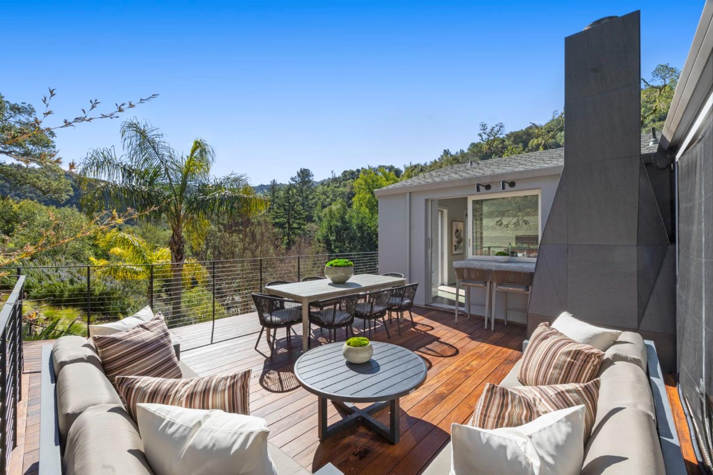 27201 Moody Road Los Altos Hills, CA 94022 - Photo 20 of 43 a view of a patio with couches table and chairs and potted plants