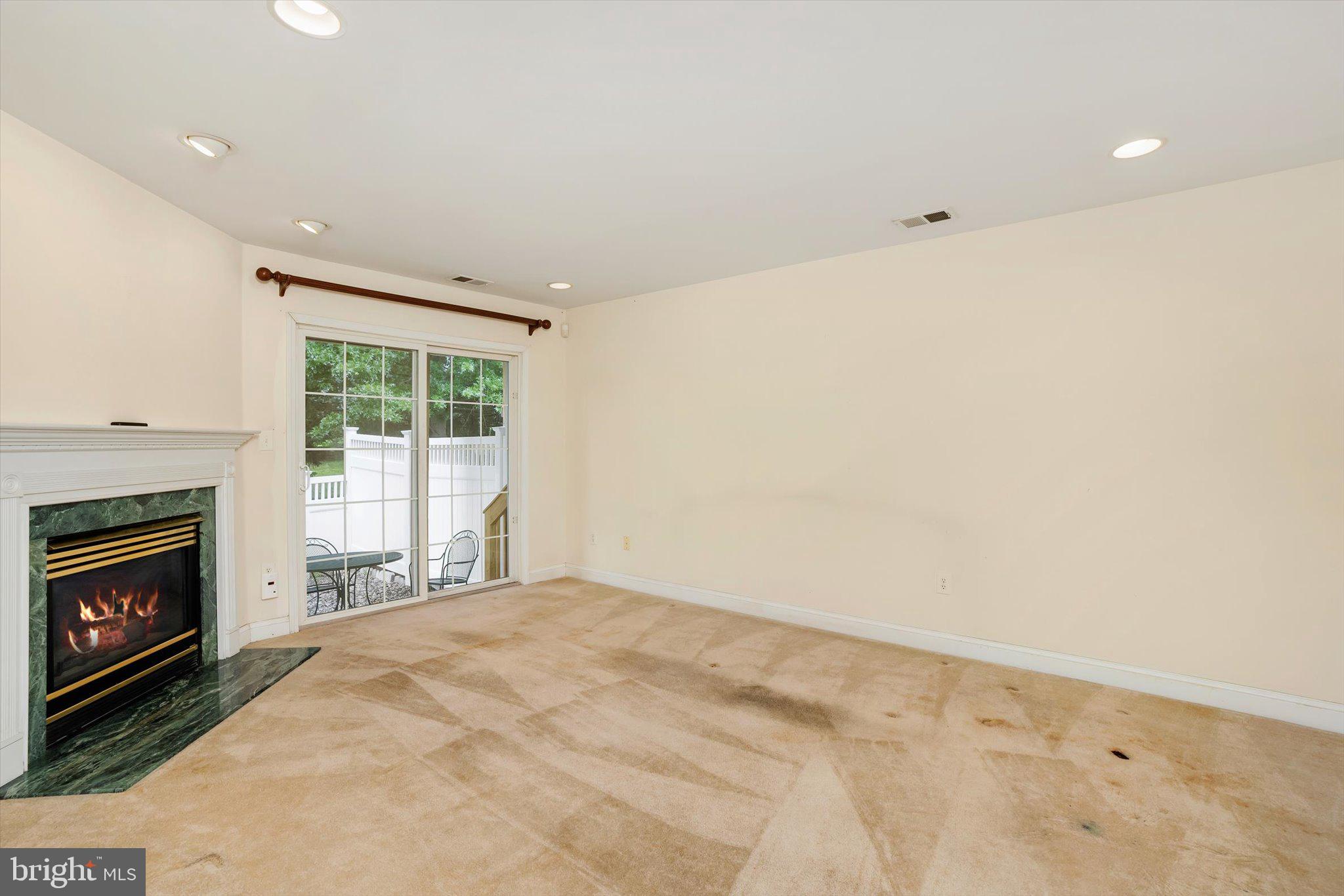 132 Coburn Road Pennington, NJ 08534 - Photo 17 of 50 Spacious living area with fireplace charm.