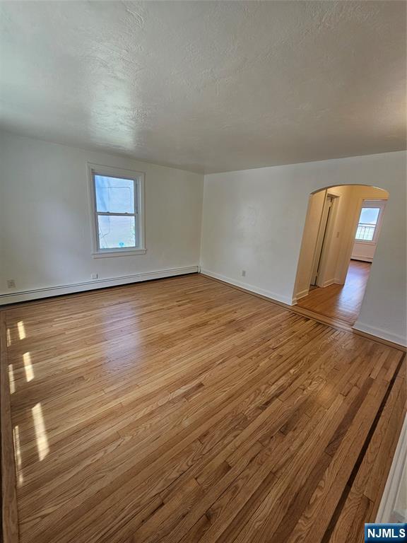 75 East Fort Lee Road, Unit 1 Bogota, NJ 07603 - Photo 3 of 8 a view of a room with wooden floor
