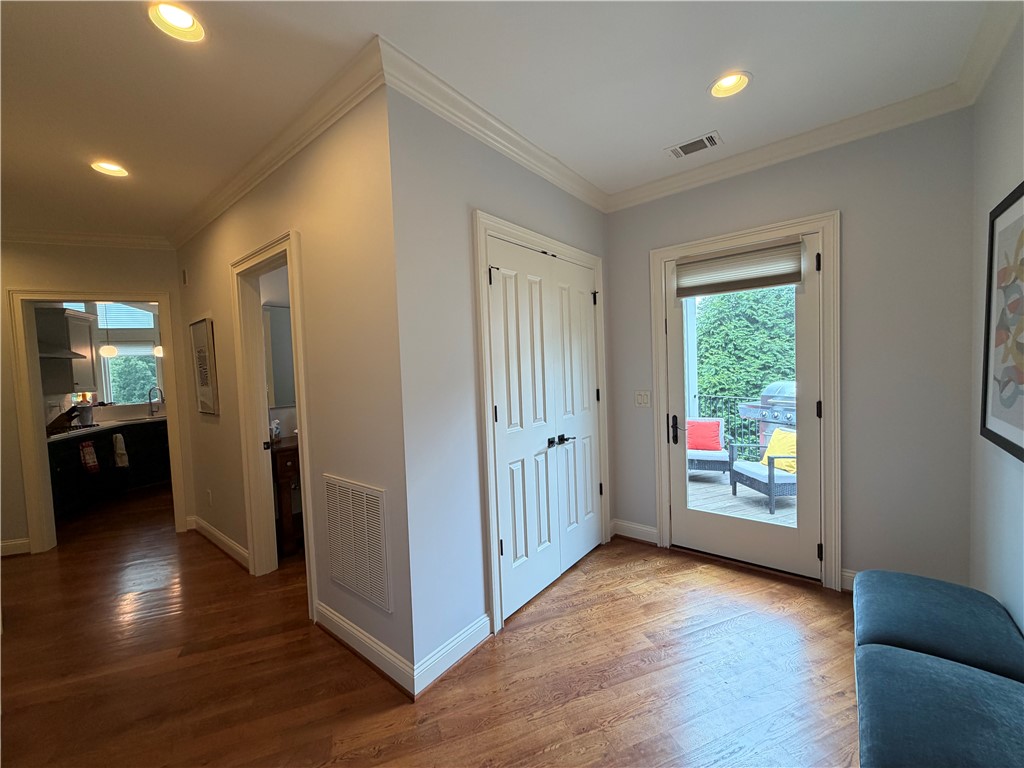 357 Stardust Lane Seneca, SC 29672 - Photo 29 of 50 Mud Room - Polished hardwood floods and elegant crown molding elevate this versatile transition space near the deck.