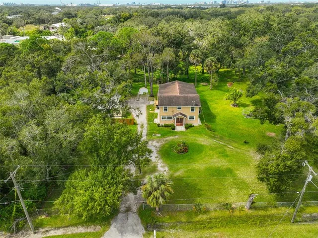 a backyard of a house with lots of green space