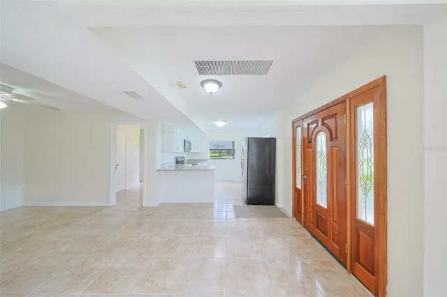 a view of a chandelier fan and a chandelier fan in a room