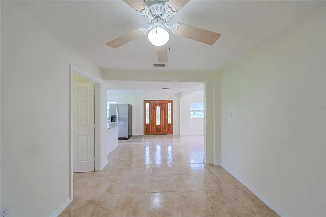 a kitchen with stainless steel appliances a sink stove and refrigerator