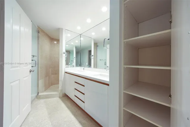 a bathroom with a double vanity sink and mirror