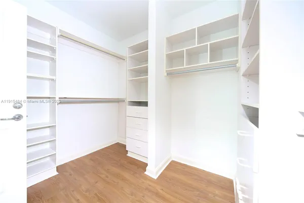 a view of an empty walk in closet