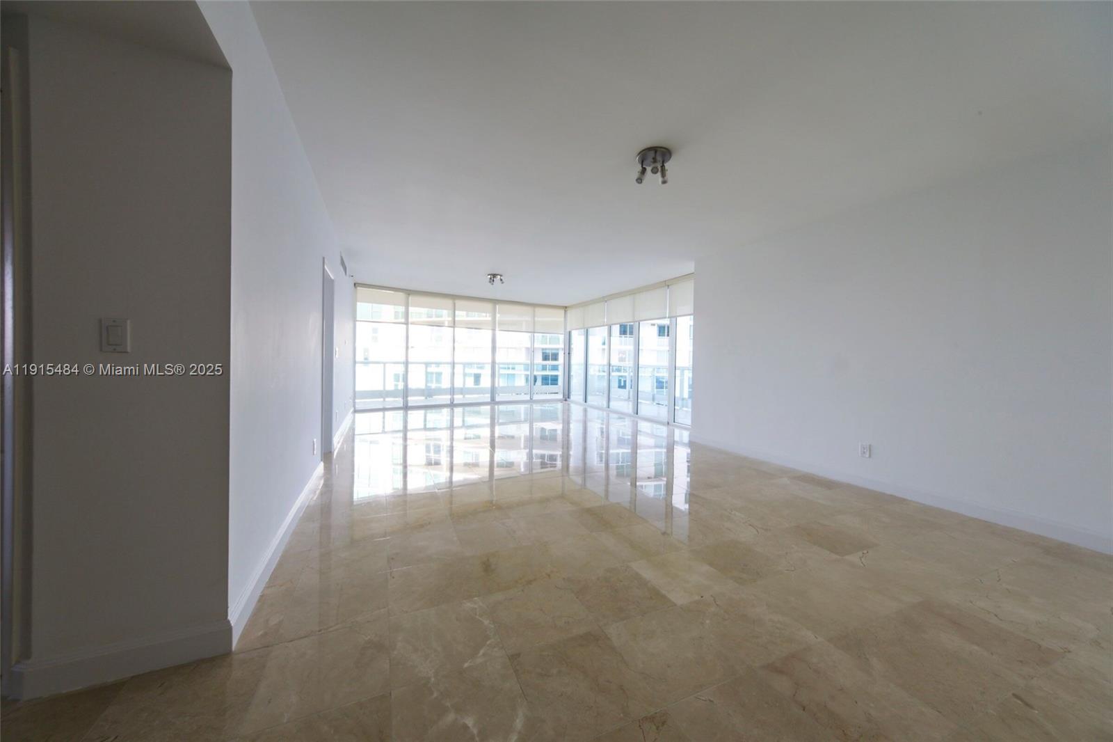 2127 Brickell Avenue, Unit 2504 Miami, FL 33129 - Photo 2 of 41 a view of an empty room with a window