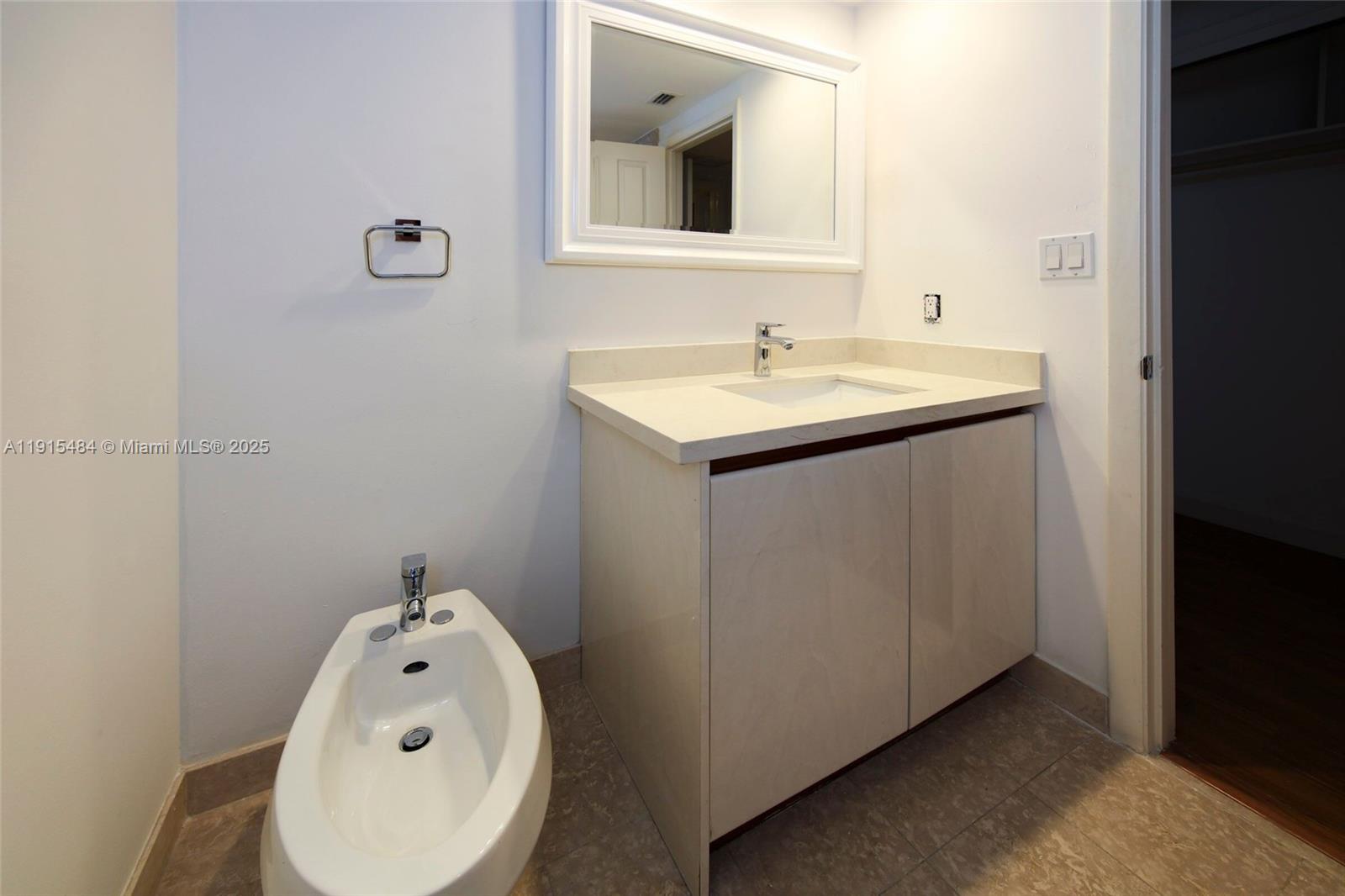 2127 Brickell Avenue, Unit 2504 Miami, FL 33129 - Photo 25 of 41 a bathroom with a sink and vanity