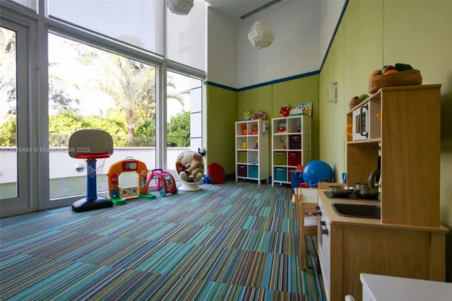 a bedroom with bunk bed and a window