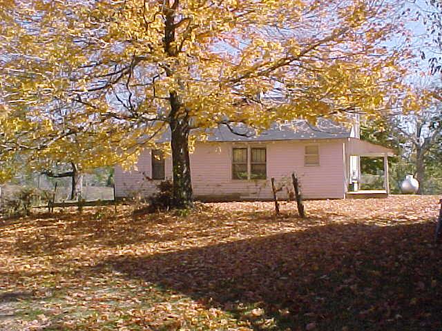 VIEW OF REAR OF HISTORIC FARMHOUSE.