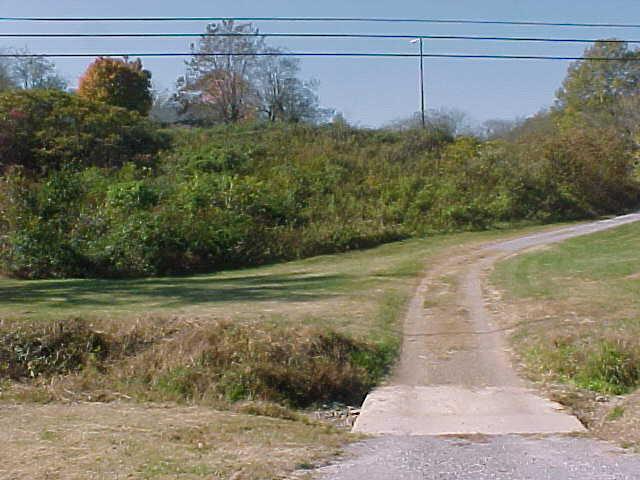 VIEW OF DRIVEWAY ENTERING FARM.
