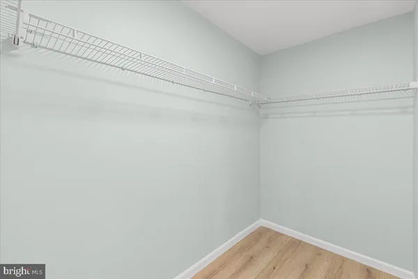 a view of a room with shelf on the wall