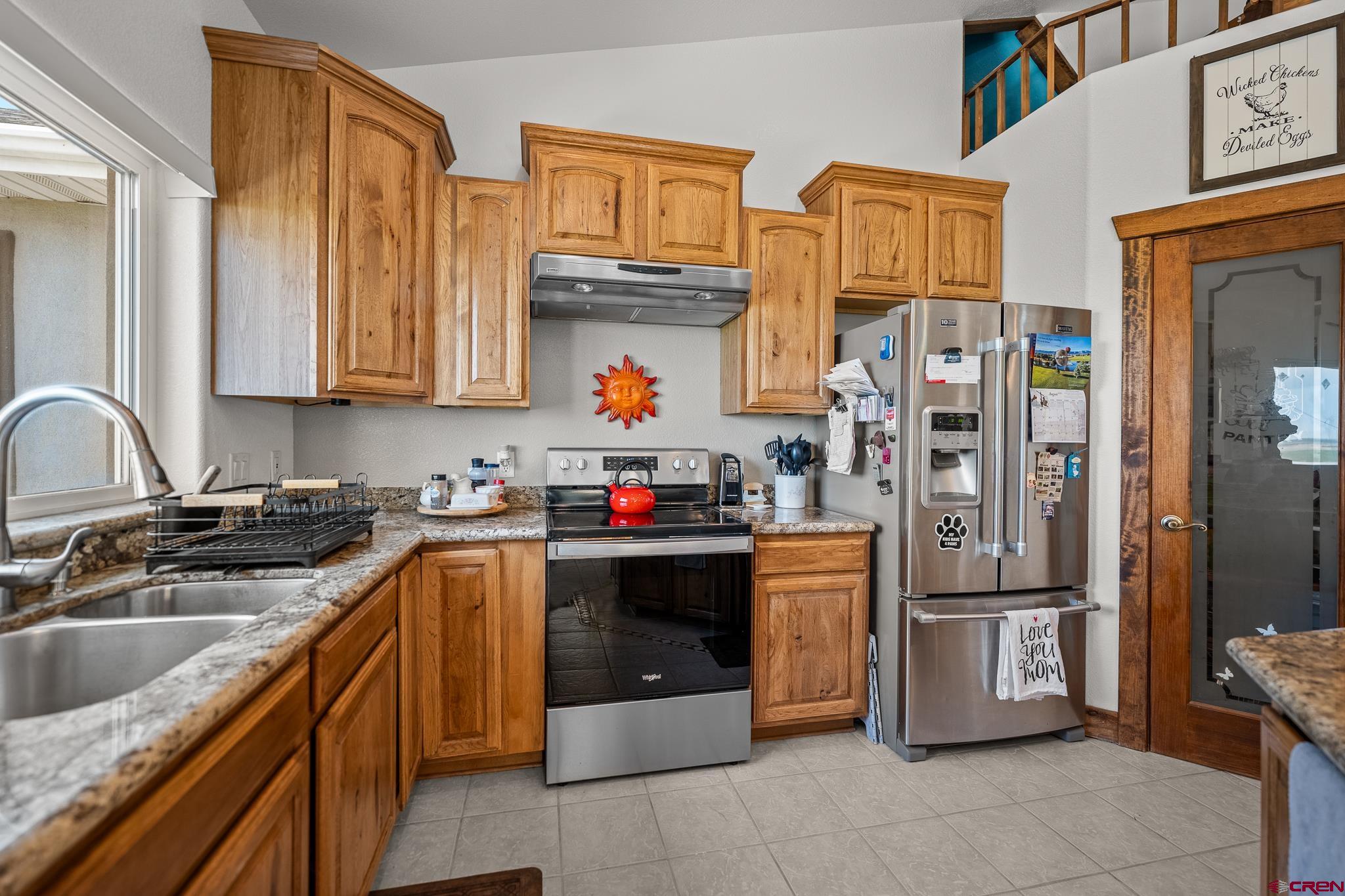 13723 Rd T Cahone, CO 81320 - Photo 11 of 36 a kitchen with stainless steel appliances granite countertop a refrigerator and a sink