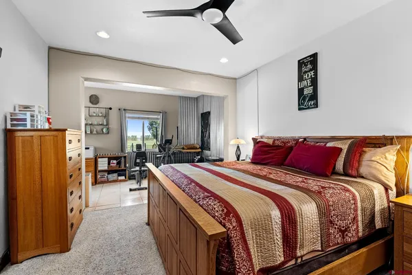 a bedroom with bed and window