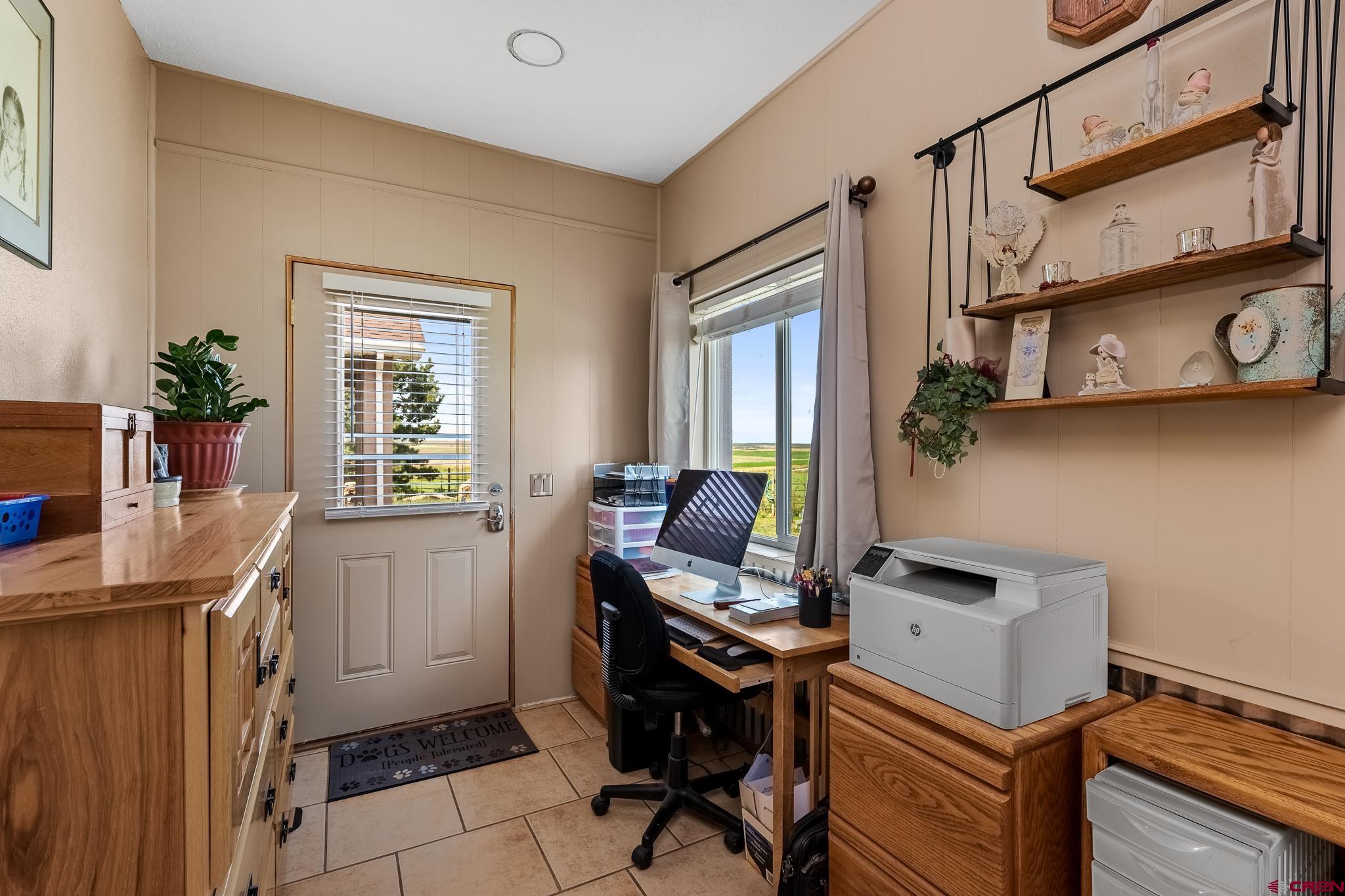 13723 Rd T Cahone, CO 81320 - Photo 15 of 36 a view of a workspace with furniture and a window
