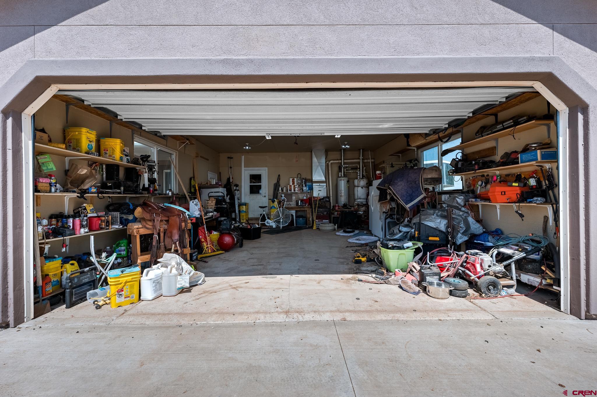 13723 Rd T Cahone, CO 81320 - Photo 22 of 36 a view of a storage room with a lot of stuff
