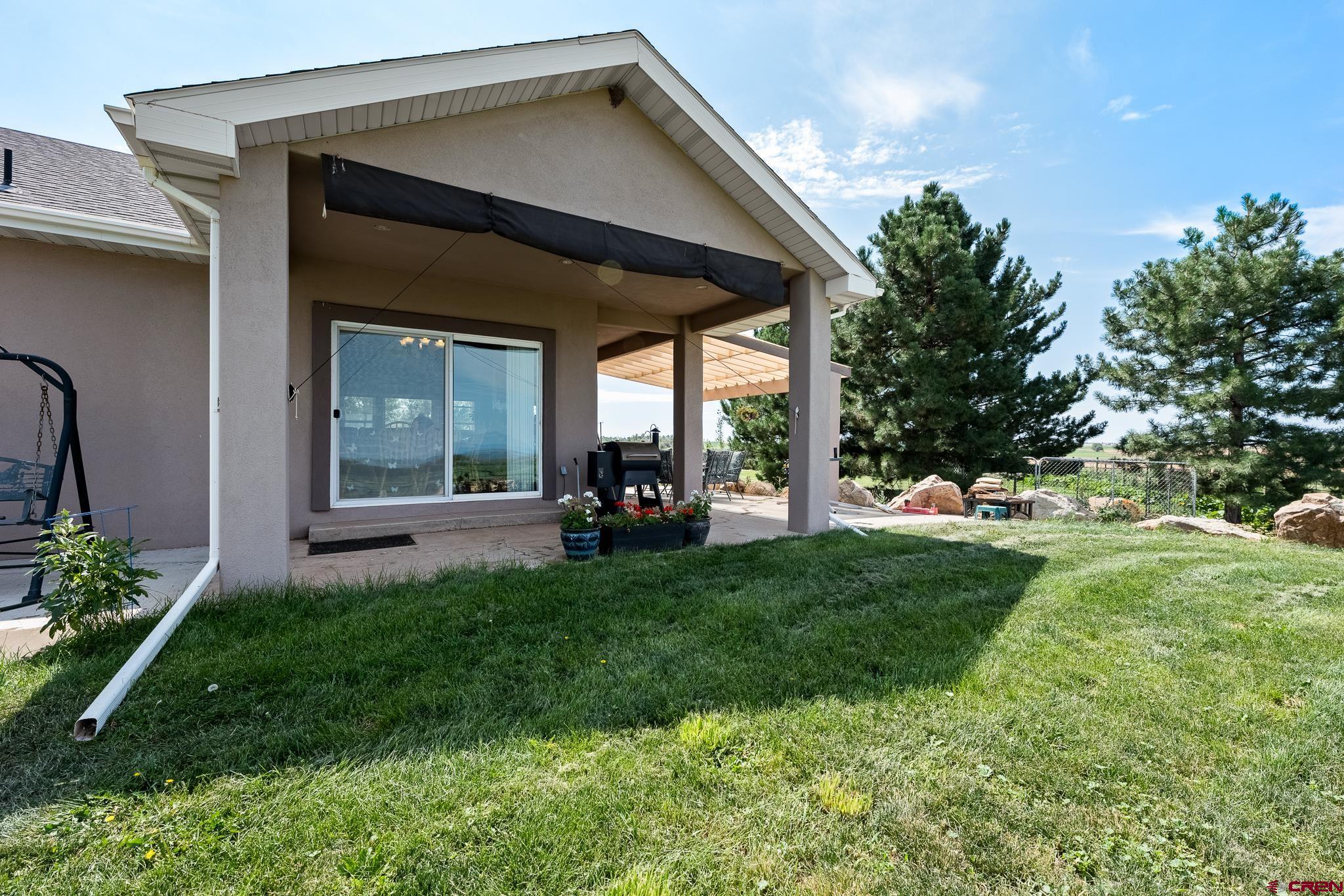 13723 Rd T Cahone, CO 81320 - Photo 24 of 36 a view of a chair and table in backyard of the house